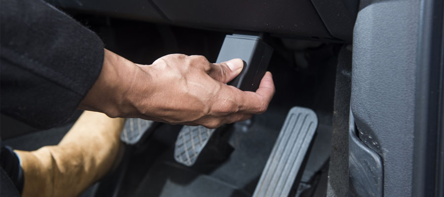 Man adding a Black Box to the Car